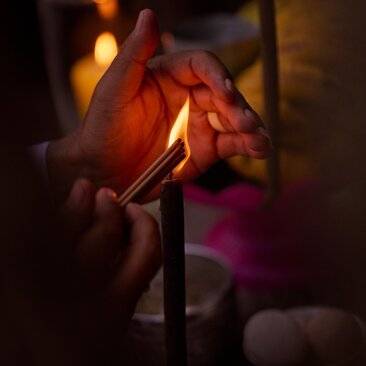 Cham blessing ceremony at Amanoi resort, Vietnam, with incense and candlelight during sacred dining experience.