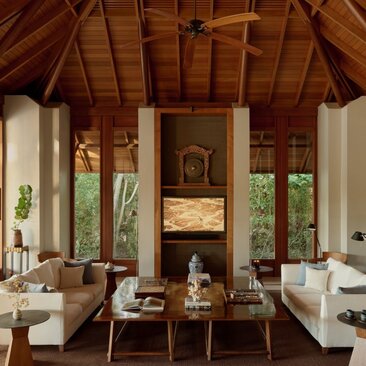 Villa living area at Amanyara with soaring wooden ceiling and central fireplace, Turks and Caicos.