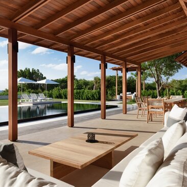 Four-bedroom villa terrace at Amanyara with wooden pergola, sunken seating area, and plunge pool overlooking tropical gardens.