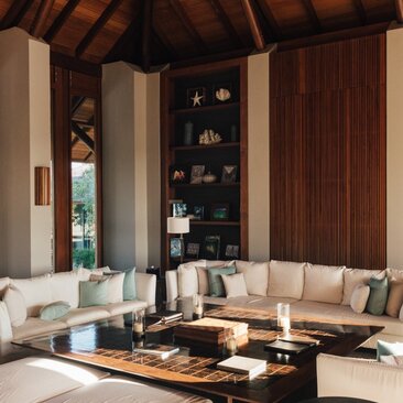 Four-bedroom beach sala at Amanyara with sunken seating area and central fireplace.