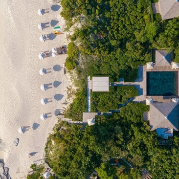 Aerial view of a four-bedroom beach villa at Amanyara with direct access to white sand and turquoise waters, Turks and Caicos.