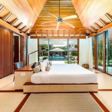 Six-bedroom villa at Amanyara with principal bedroom opening to ocean views and terrace beyond.