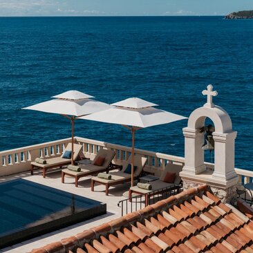 Signature pool at Aman Sveti Stefan overlooking the Adriatic Sea, Montenegro.