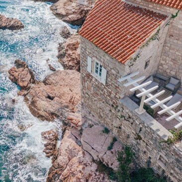 Terrace overlooking the Adriatic Sea at Aman Sveti Stefan, a three-bedroom cottage in Montenegro.