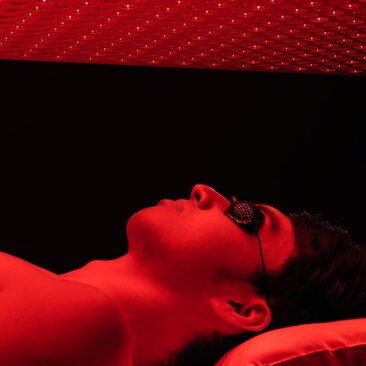 Person relaxing in red-light therapy at Amanyangyun's spa and wellness facility in China.