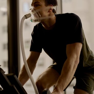 Man working out on exercise equipment at Aman New York fitness centre.
