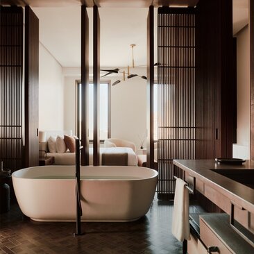 Salle de bains avec baignoire autoportante et panneaux de bois sombre à Aman New York.