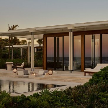 Beachfront casita with wooden shutters and private pool at Amanvari, Mexico, at sunset.