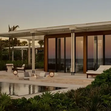 Beachfront casita with wooden doors and terrace at Amanvari resort, Mexico.