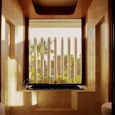Beachfront casita window with wooden frame overlooking garden at Amanvari resort, Mexico.