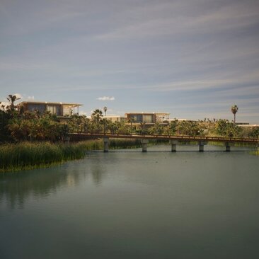 Casita exterior overlooking a tranquil river and distant landscape at Amanvari, Mexico.