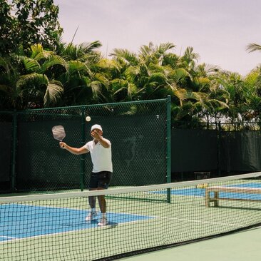 Guest playing pickleball at Amanera, Dominican Republic.