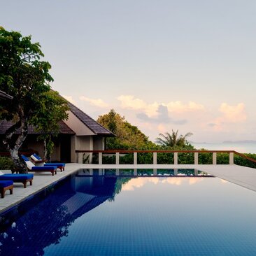 Villa with private pool overlooking tropical gardens at Amanpulo resort, Philippines.