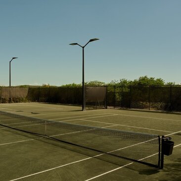 Tennis racquet and balls on court at Amandari.