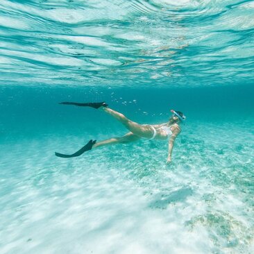 Snorkeller exploring turquoise waters at Amanyara, Turks and Caicos.