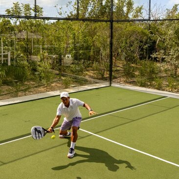 Two padel players on court at Amanyara, Turks and Caicos.