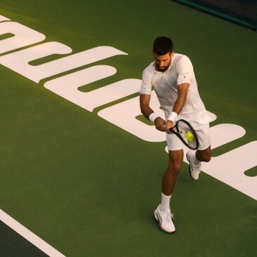 Novak Djokovic playing tennis on the courts at Amanpuri, Thailand.