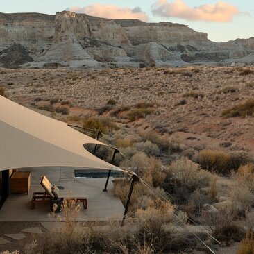 Camp Sarika exterior at Amangiri with desert landscape and sandy terrain.