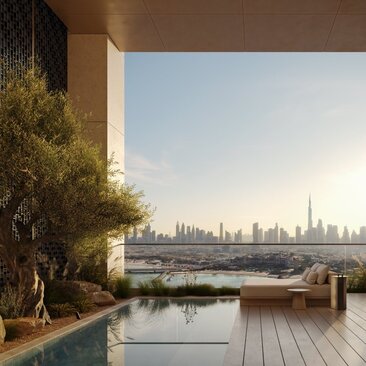 External terrace at Aman Residences Dubai with city skyline view across the water.