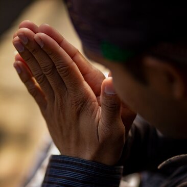 Hands joined in prayer at Amanjiwo, Java, Kotagede Old Town.