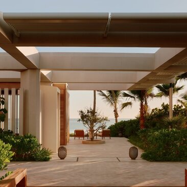 Beachfront casita arrival courtyard with pergola and ocean view at Amanvari, Mexico.