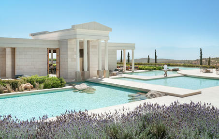 Amanzoe hilltop pavilions and infinity pool overlooking the Aegean