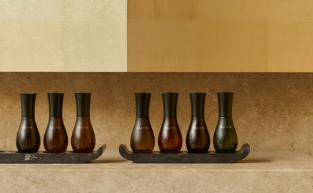 Aman Essentials spa product bottles arranged on a shelf at Amanzoe, Greece.