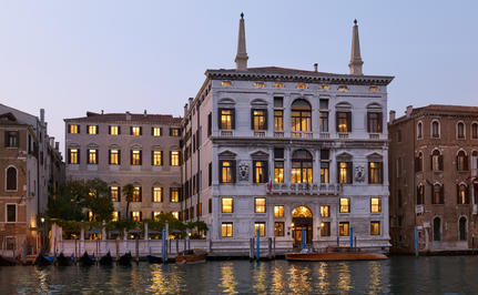 Palazzo façade illuminated at night along the Grand Canal, Aman Venice.