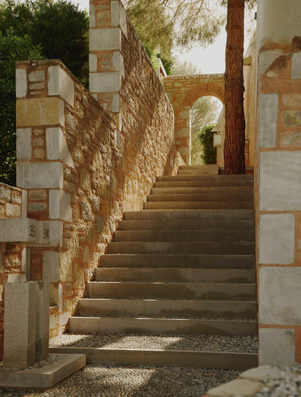 Stone staircase with archway at Amanruya, Turkey resort architecture.