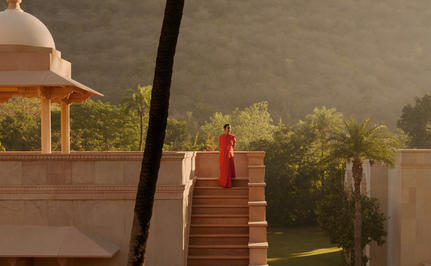 Amanbagh's main building exterior with Amansanti spa pavilion visible through morning mist.