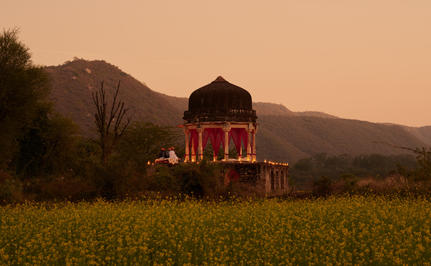Chhatri pavilion lit at dusk for dinner, Amanbagh.