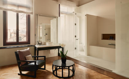 Palazzo Stanza bathroom at Aman Venice with walk-in shower, vanity, and neutral tones.