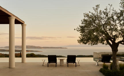 Four-bedroom villa terrace at Amanzoe with sea views at sunset.