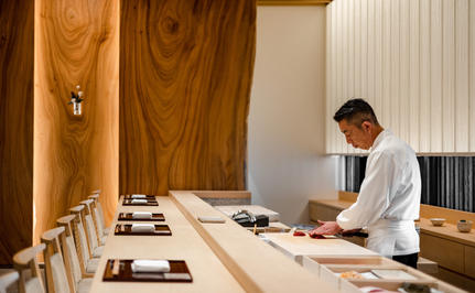 Master Chef Hiroyuki Musashi prepares a dish at Aman Tokyo's dining venue.