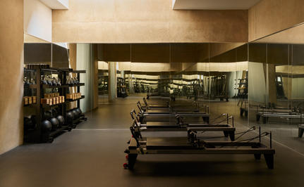 Amangiri's spa and gym facility with exercise equipment and warm-toned interior lighting.