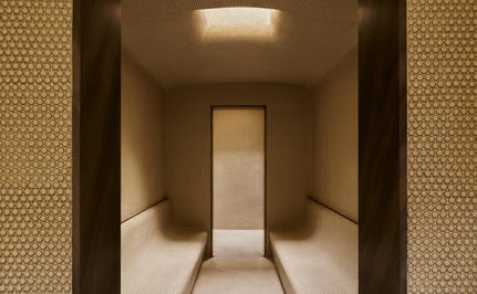 Steam room at Amangiri spa with warm stone walls and soft lighting.