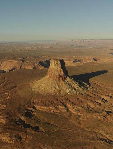 Aerial view of a distinctive rock formation rising from the desert landscape at Amangiri.