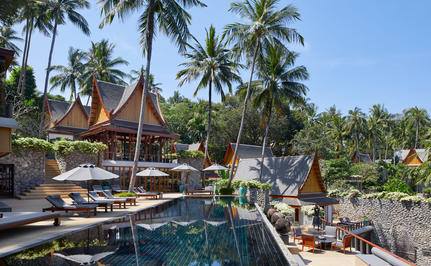 Eight-bedroom ocean villa terrace overlooking infinity pool and tropical gardens at Amanpuri.