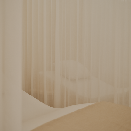 Spa and wellness area at Aman Le Mélézin with soft, draped fabrics and warm neutral tones.