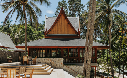 Arva Italian Restaurant exterior at Amanpuri, Thailand, with traditional Thai architecture and palm trees.