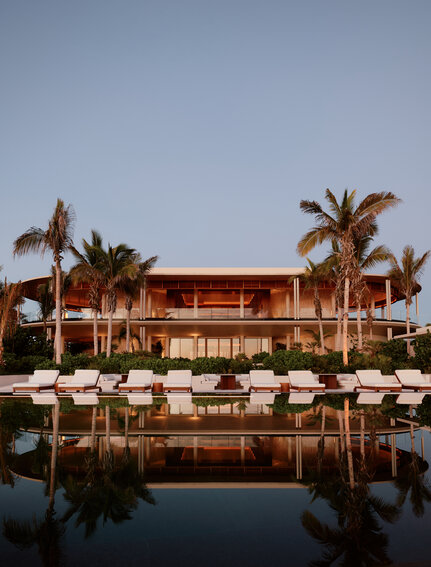 Casa Grande at Amanvari reflected in still water at dusk, Mexico.