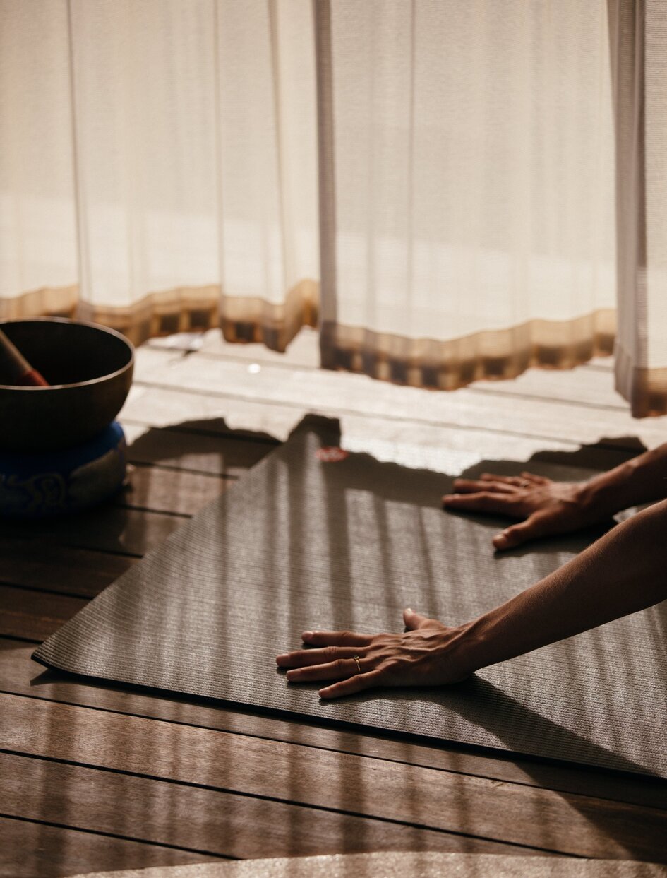 Spa treatment area at Amanyara with massage tables, folded linens, and filtered natural light.