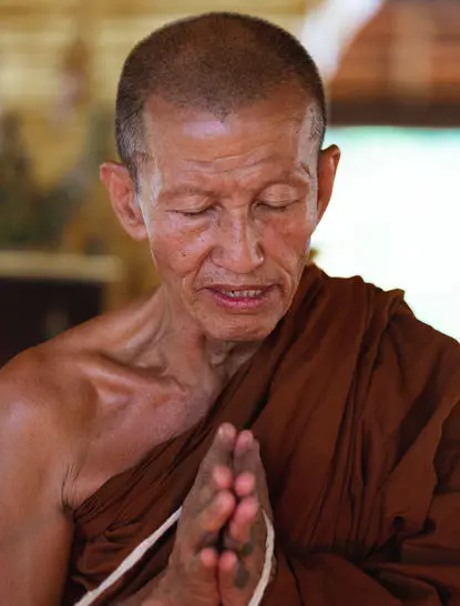 Buddhist monk in meditation robes at Amantaka, Luang Prabang.