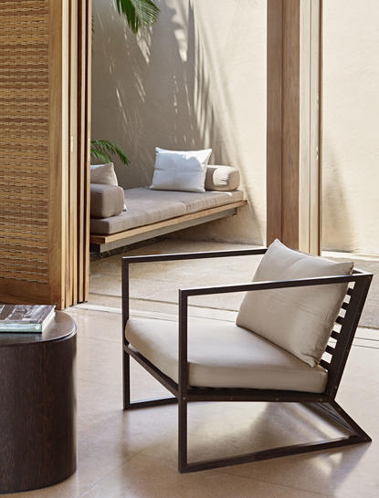 Ocean Hill Pool Suite seating area at Amanwella, with window seat and modern chair overlooking the ocean.