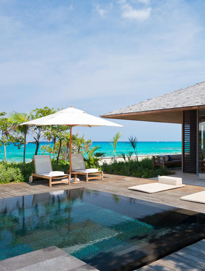 Four-bedroom ocean villa with infinity pool overlooking turquoise waters at Amanyara.
