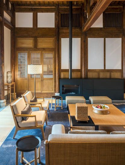 Two-bedroom antique pavilion living area at Amanyangyun with wooden screens and traditional furnishings.