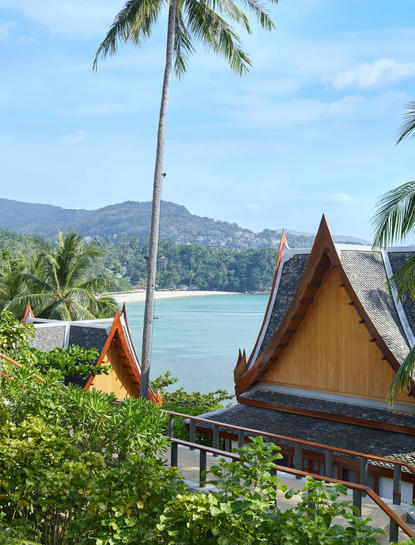 Three-bedroom ocean villa at Amanpuri with tented roof structure overlooking tropical bay and mountains.