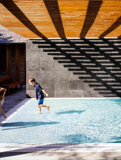Child exploring nature discovery centre with plunge pool at Amanyara, Turks and Caicos.