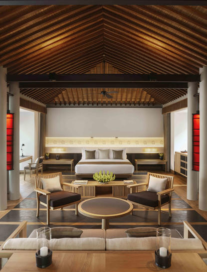 Ocean Pool Villa principal bedroom at Amanoi resort, Vietnam, featuring wooden vaulted ceiling and minimalist furnishings.