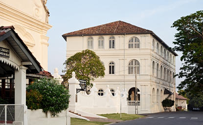 Amangalla's exterior featuring a multi-storey colonial building with cream-coloured facades and traditional architectural details.